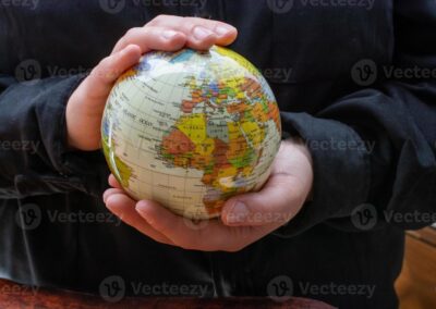 A person holding globe signifying countries requiring SOPs